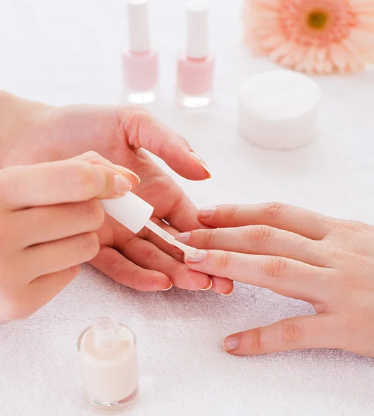 Professional manicure service with nail shaping and polish
